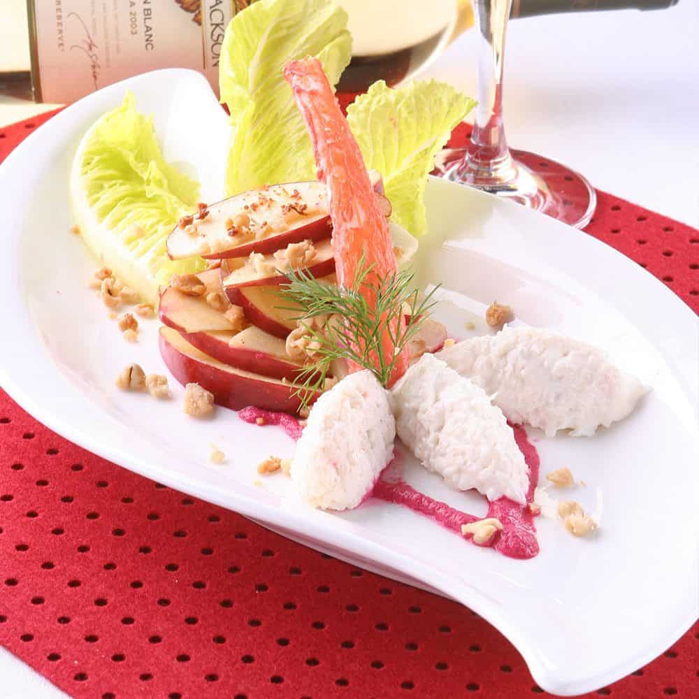 Fresh apple slices with whipped ricotta and herbs at The Flames Galore Restaurant.