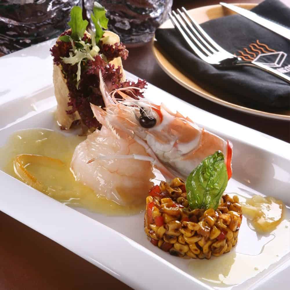 Fresh seafood dish with shrimp, vegetables, and gourmet presentation at The Flames Galore Restaurant.