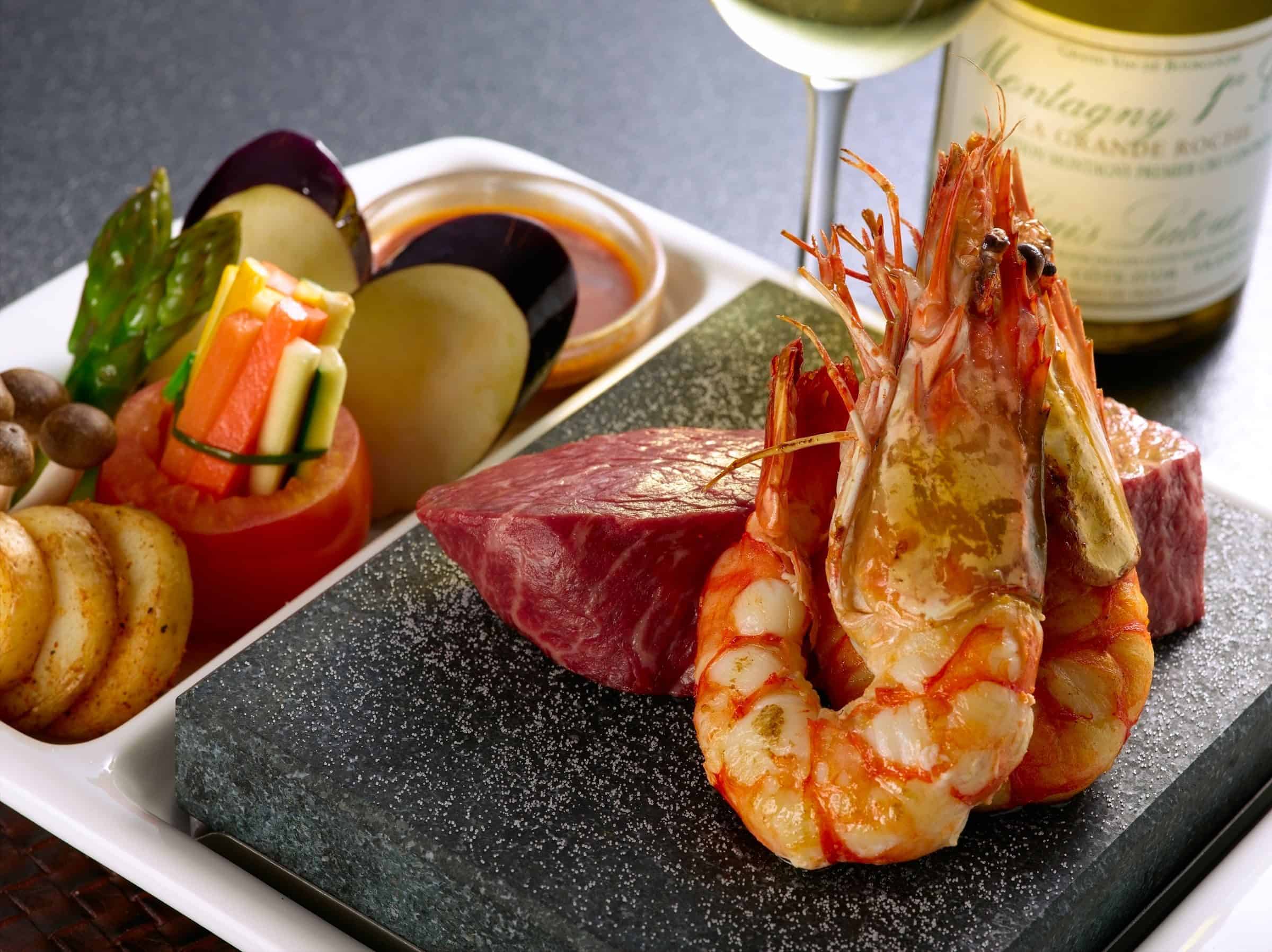 Succulent seafood and premium steak served at The Flames Galore Restaurant, perfect for fine dining & special occasions.
