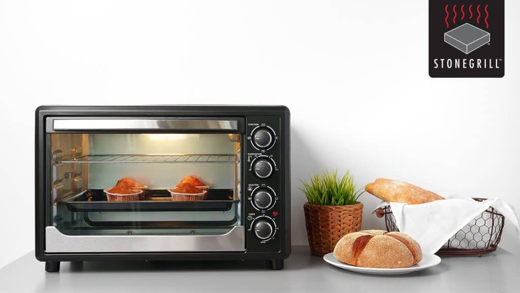 Golden-brown baked muffins in a toaster oven at The Flames Galore Restaurant.