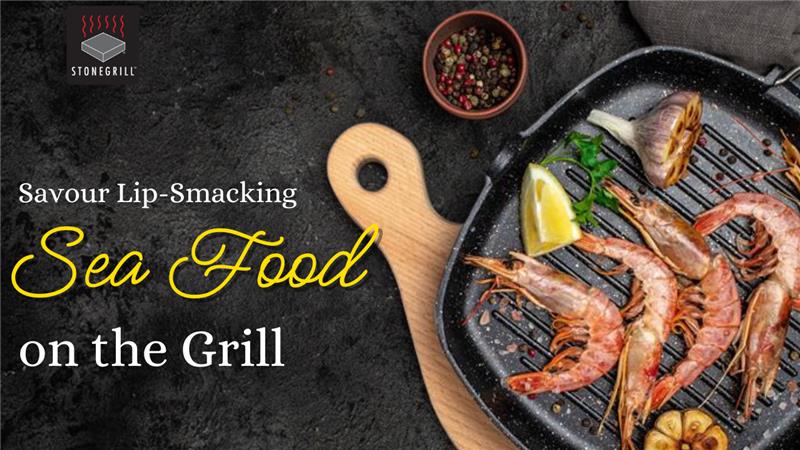 Fresh grilled seafood on a stone grill at The Flames Galore Restaurant for an authentic sea food dining experience.