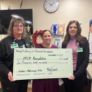 Detailed charity check presentation in Fostoria for medical fundraisers.