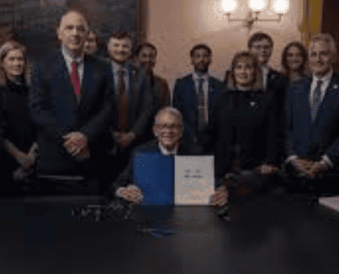 Group of professionals attending a formal event in Fostoria, Ohio, highlighting community success and local news.