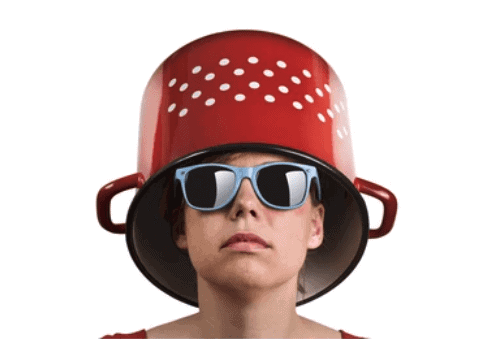 Young person wearing a colander as a hat with sunglasses, symbolizing Fostoria local news coverage.