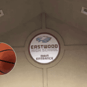 High school basketball gym entrance signage.