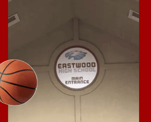 High school basketball gym entrance signage.