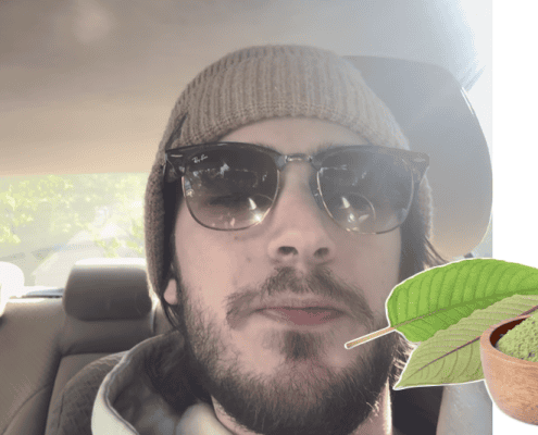 Close-up of a man wearing hat and sunglasses in a car, with green leaf and powder plant supplement in foreground.