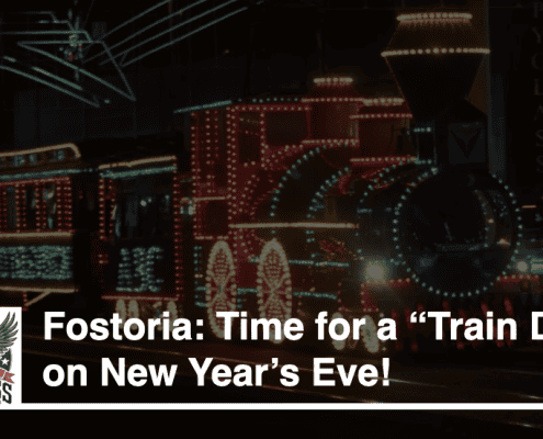 Colorful holiday train lights in Fostoria for New Year's celebration.