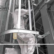 Industrial worker installing framework at manufacturing site in Fostoria.