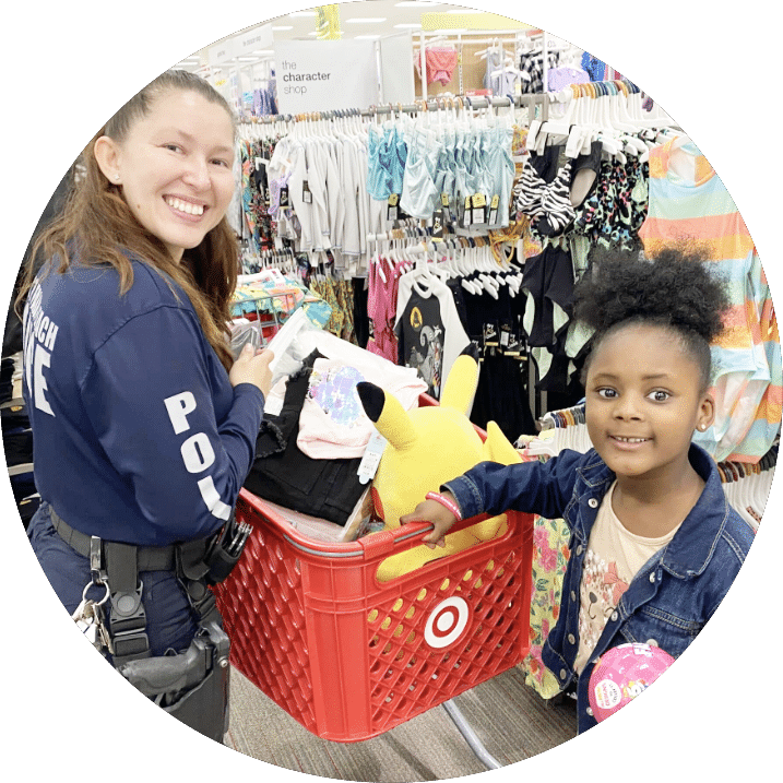 Police officer and little girl at Shop with a Cop Event
