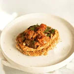 a white plate topped with food on top of a table