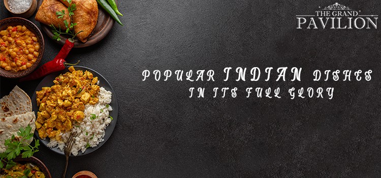 Spicy Indian dishes served with rice and curries at The Grand Pavilion Indian restaurant, showcasing authentic Indian cuisine.