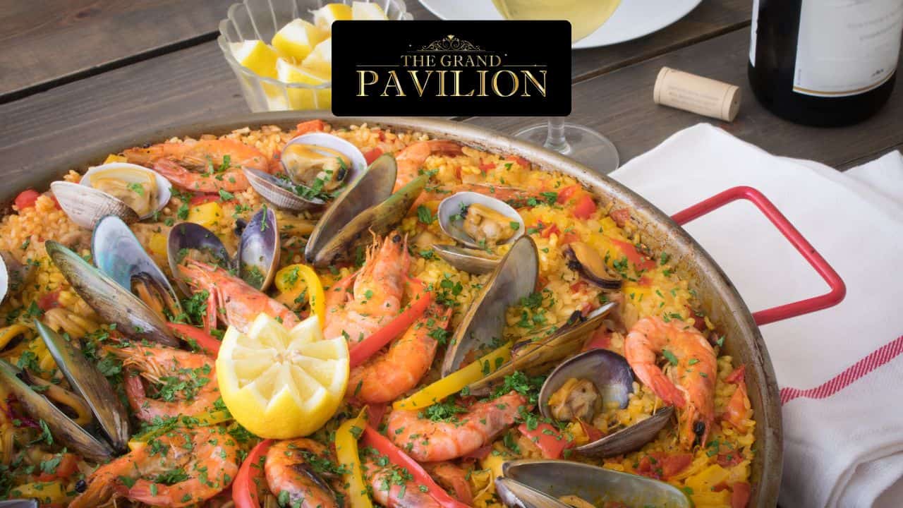 Seafood paella with shrimp, mussels, and vibrant vegetables.