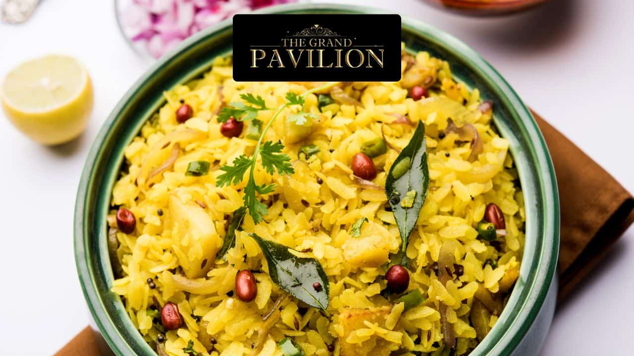 Steamed Indian vegetable biryani garnished with fresh herbs and spices, served in a decorative bowl.