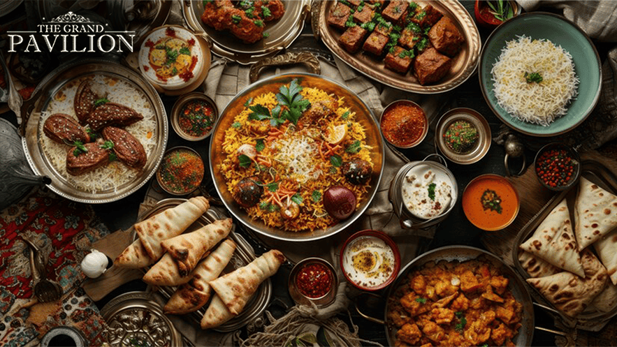 Rich Indian cuisine spread with biryani, naan, curries, and snacks at The Grand Pavilion restaurant in Australia.