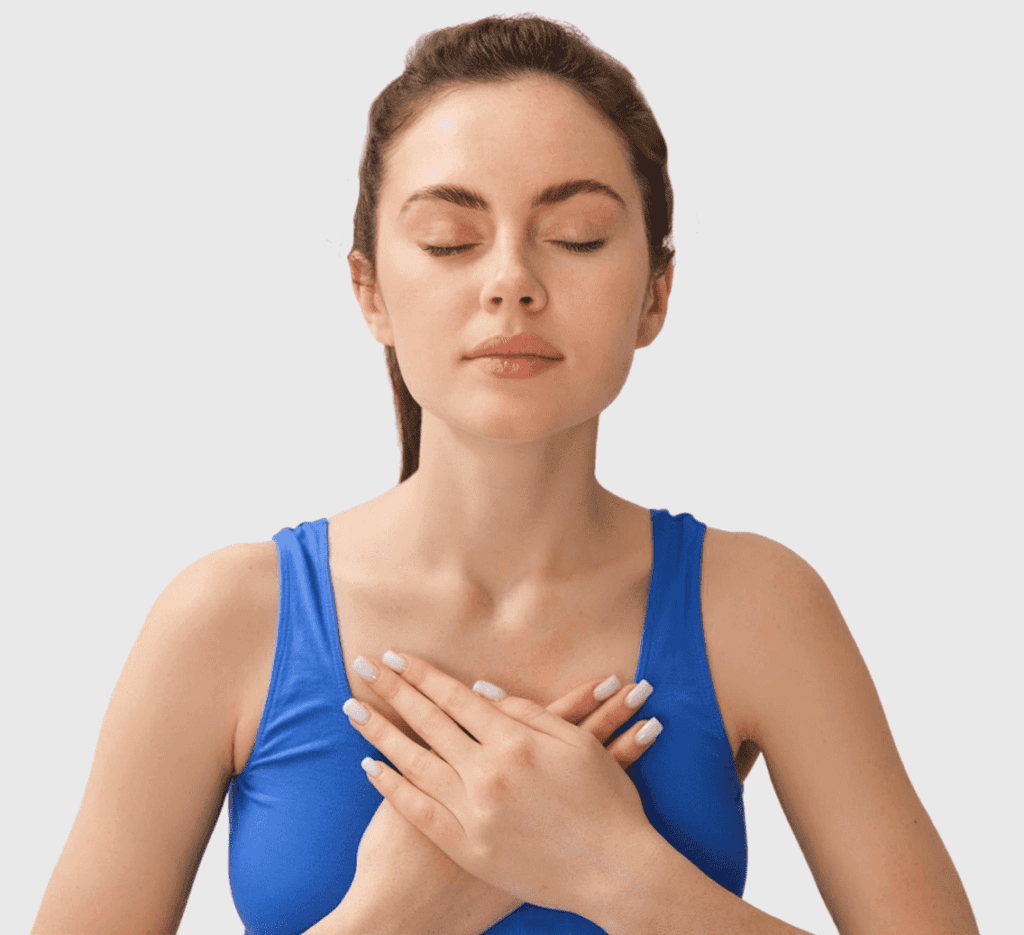 hands on heart of meditating woman