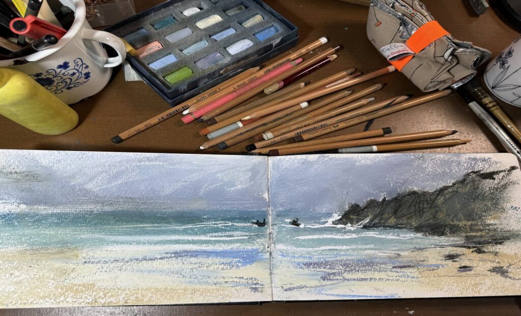 Watercolor painting tools and artwork by Nina Squire on a workspace.