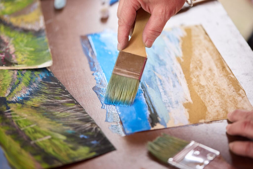 Painting with pastels and liquid on specialist surface by artist Nina Squire