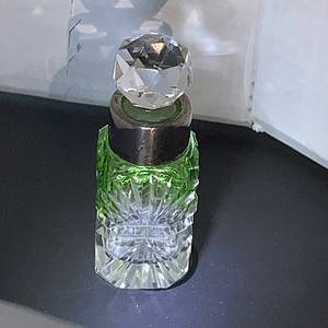 Vintage Cut glass perfume bottle with sterling silver collar and partial uranium glass colouring to bottle Excellent condition. Sold
