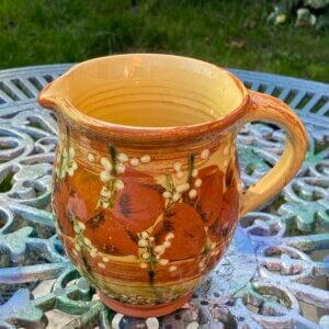 Lovely terracotta hand painted jug possibly french
