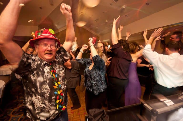 Corporate party guests dancing