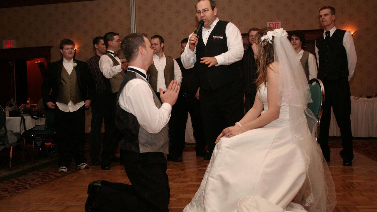 Wedding DJ hosting a fun game with bride and groom at Kelowna reception