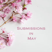 Branch of pink cherry blossoms on a white surface with the text “Submissions in May” in pink font.