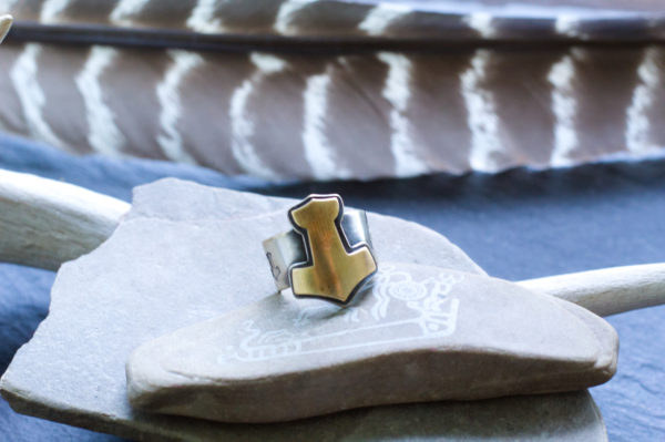 brass and silver mjolnir ring