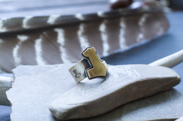 brass and silver mjolnir ring