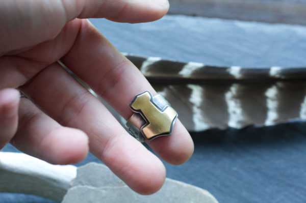 brass and silver mjolnir ring