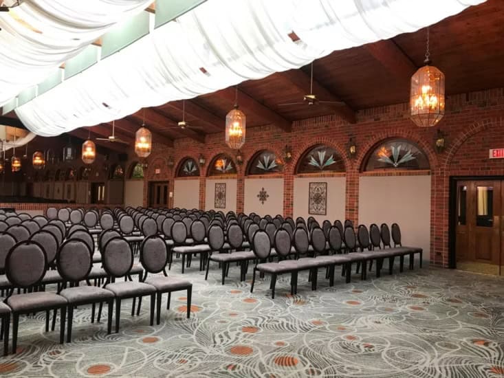 Ballroom with seating for an event. Gallery Image