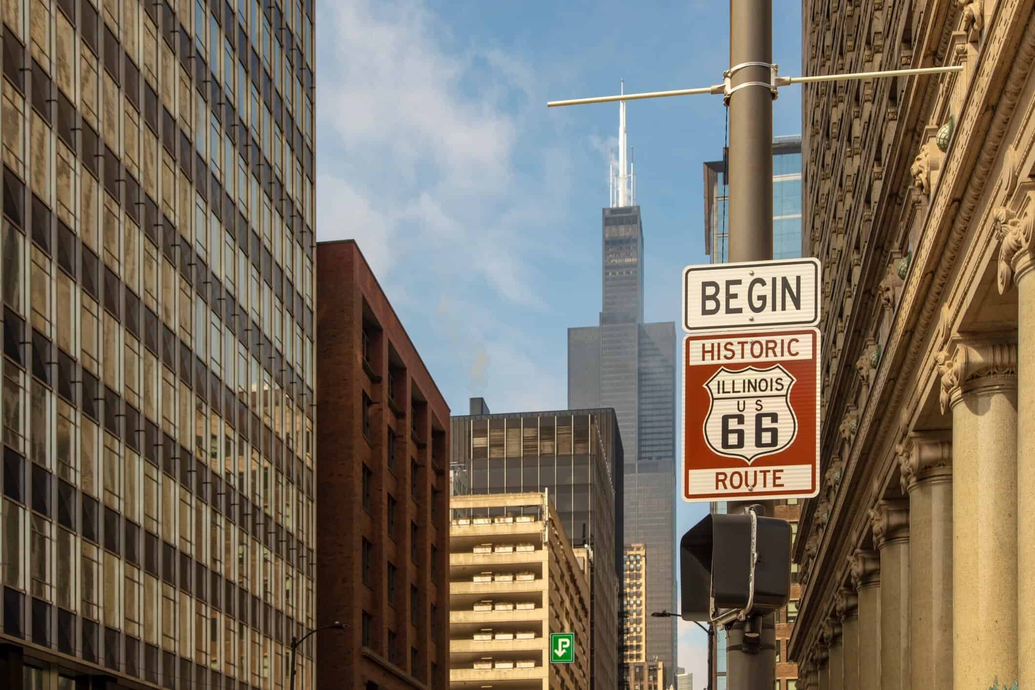 Historic Route 66 Begin sign on a Chicago street with the Willis Tower visible in the background