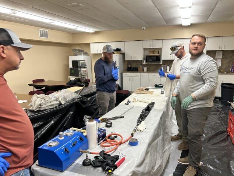 Thompson Trenchless and Hydro Jetting team learns pipe repair skills in a hands-on training for better plumbing solutions.