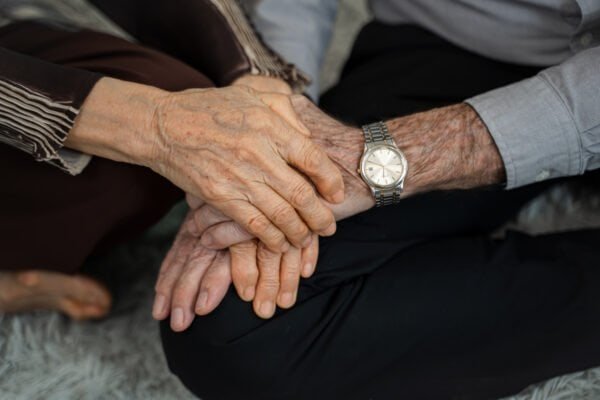 Senior husband and wife holding hands to encourage,eternal love, trustworthy harmonic relations between older spouses concept.