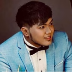 Man in blue suit and bowtie