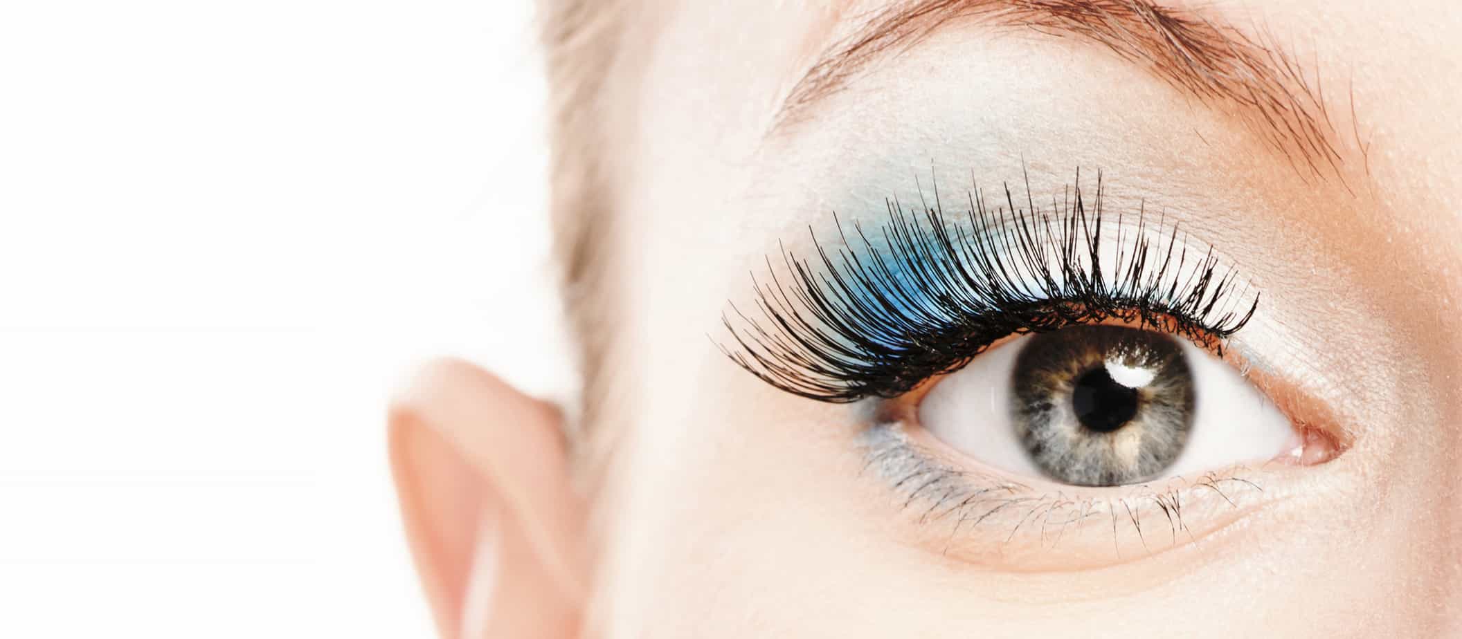 eye with long lashes from lash extensions and lash tinting