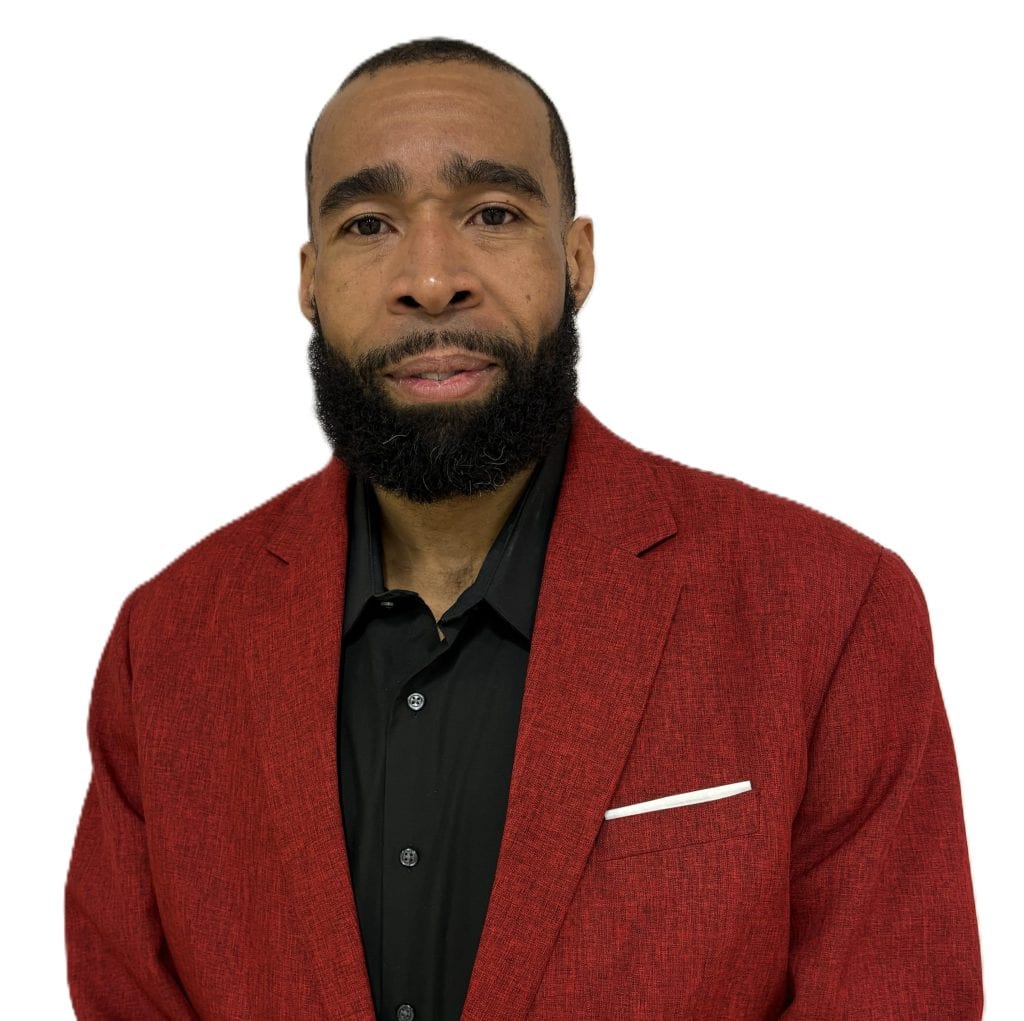 Professional business portrait of a man in a red blazer and black shirt.