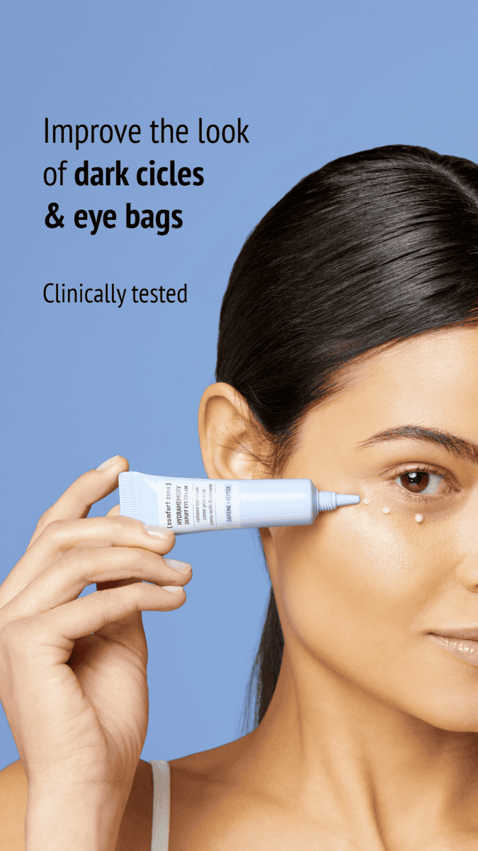 Woman applying Hydramemory Depuff Eye Cream to reduce dark circles and eye bags.