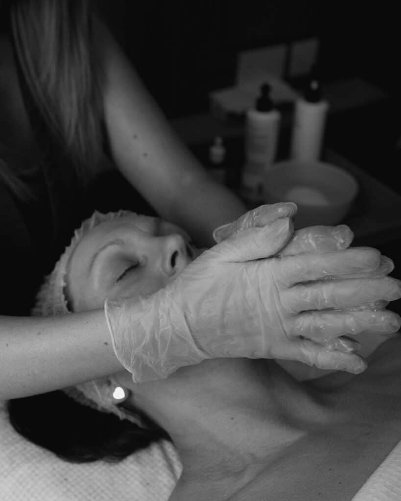 Relaxing facial treatment with skincare products at Tonic Day Spa.