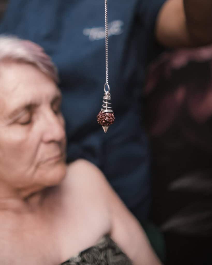 Woman receiving crystal healing therapy for holistic wellness at Tonic Day Spa.