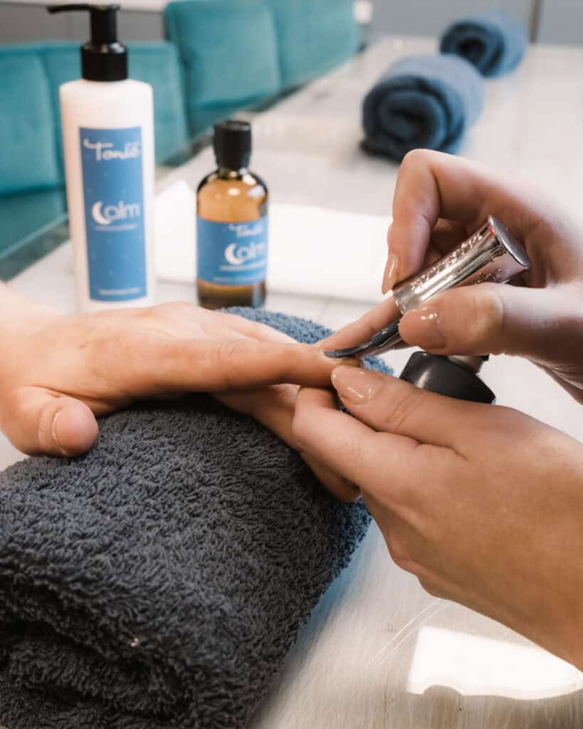 Pregnancy massage being prepared with skincare products at Tonic Day Spa.