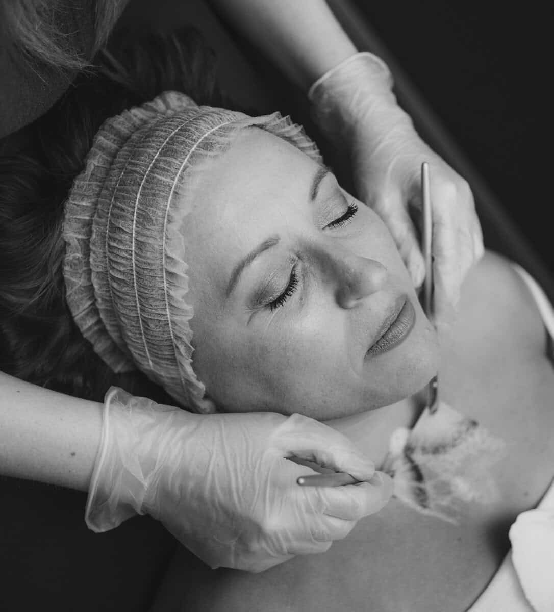 Woman receiving facial skin treatment at Tonic Day Spa, relaxing skincare session.
