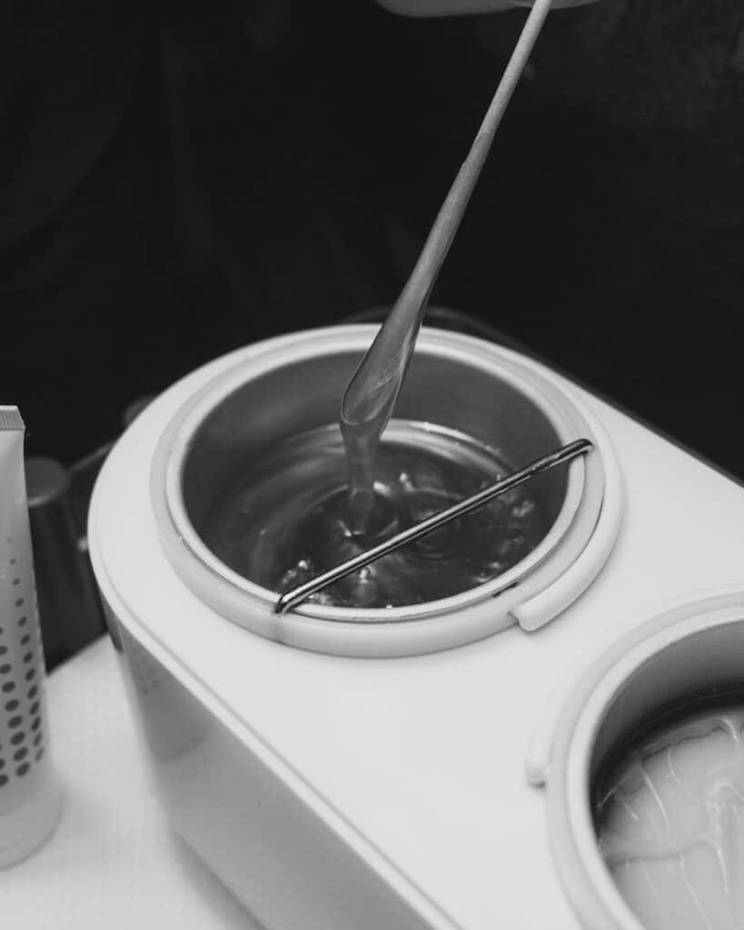 Waxing treatment with warm wax being applied to skin at Tonic Day Spa.