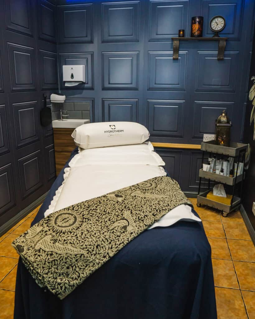 Relaxation massage bed in a spa treatment room, perfect for personalised wellness packages.