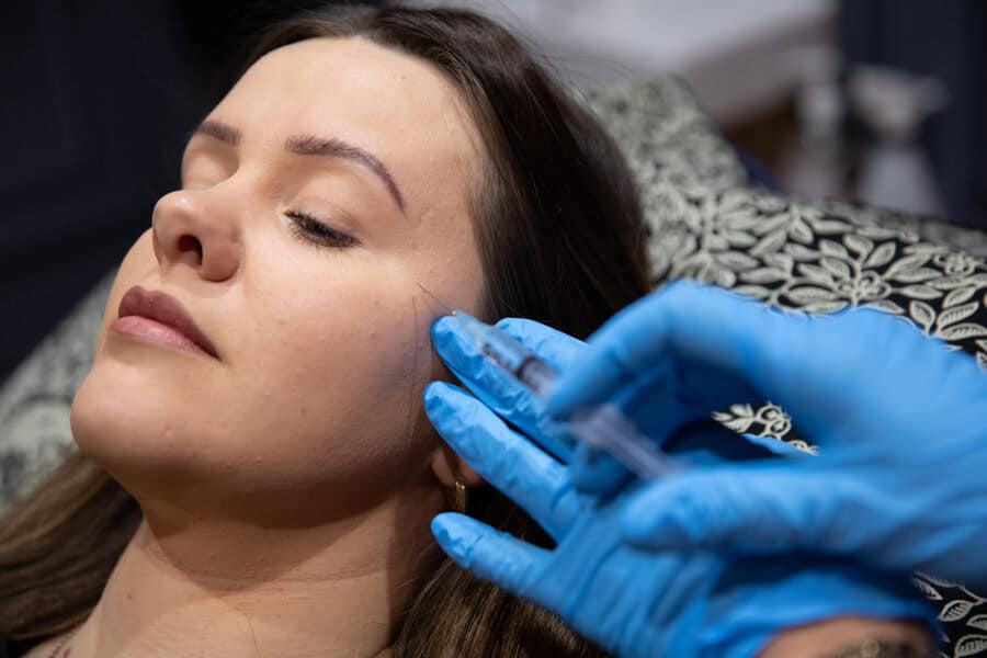 Aesthetic skincare treatment being performed on a woman at Tonic Day Spa.