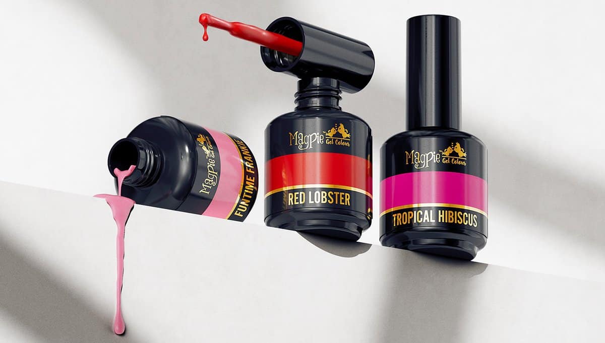 Nail polish bottles with pink polish spilling, on a white background.