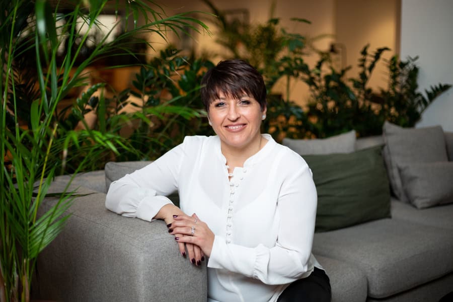 Julia enjoying a relaxing moment at Tonic Day Spa in a serene lounge setting.
