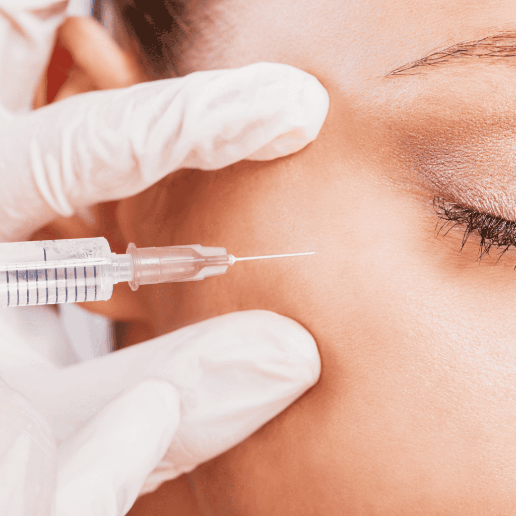 Close-up of a woman receiving dermal filler injection for facial aesthetics.