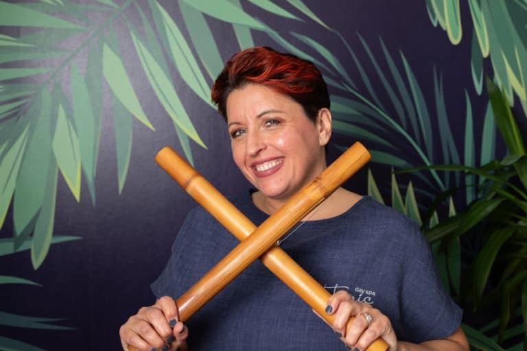 Relaxing spa treatment with wooden massage tools at Tonic Day Spa.