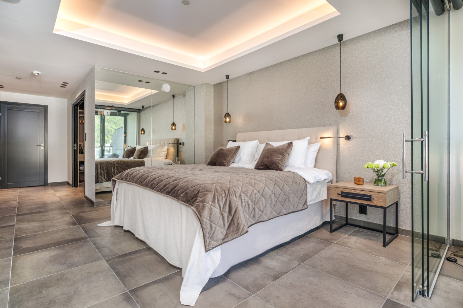 Luxury hotel bedroom with modern decor and stylish lighting, perfect for a comfortable stay in Top The Fjords.